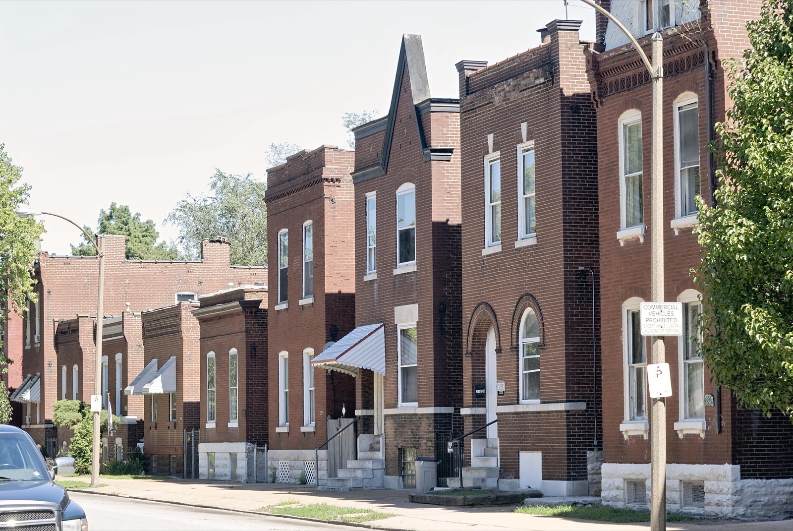 A row of brick houses on a quiet street